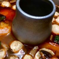 TOM YUM KOONG · mild spicy & sour shrimp broth, thai herbs,lime juice, mushroom, tomatoes, & basil