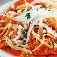 Chilaquiles · Strips of fried corn tortillas simmered in salsa, topped with eggs, cheese, onions, and cila...