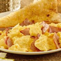 Huevos Con Jamon · Ham and eggs scrambled served with potatoes a la mexicana and beans.