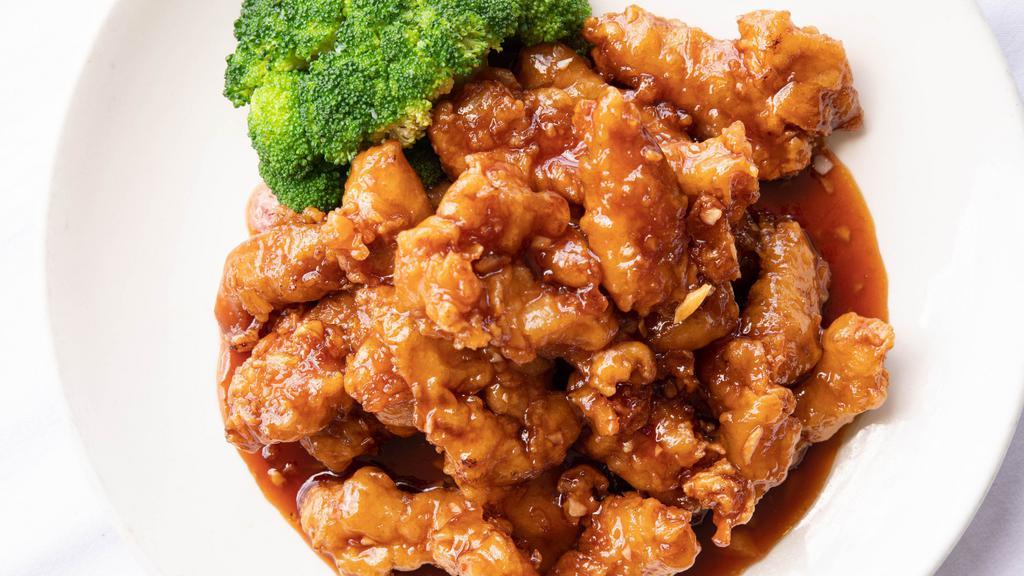 Orange Chicken · Fried and garnished with broccoli.