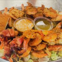 Mariscada 2pl. · Crab, breaded prawns, bacon wrapped prawns, breaded fish filet, prawns in garlic sauce, praw...
