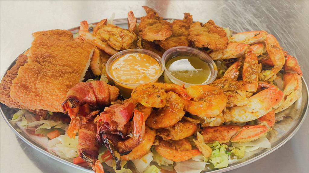Mariscada 2pl. · Crab, breaded prawns, bacon wrapped prawns, breaded fish filet, prawns in garlic sauce, prawns in  diablo sauce, grilled prawns, side of rice, beans & homemade tortillas