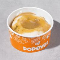 Mashed Potatoes With Cajun Gravy · Smooth, creamy mashed potatoes covered with Popeyes' flavourful cajun gravy.