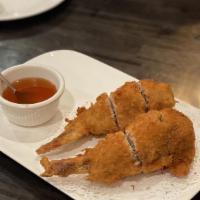 A6. Wing of Angel · Deep fried stuffed chicken wings served with sweet and sour sauce.