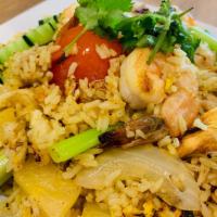 2. Pineapple Fried Rice · Chicken, pork and shrimp stir-fried with steamed rice and egg mixed with pineapple, onion an...