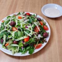 Mixed Greens Salad · Mountain of mix greens, tomatoes, cucumber, green bell peppers, onions, olives, and side dre...