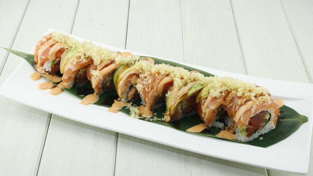 CRUNCH SALMON ROLL · In: spicy salmon, cucumber
Top: Salmon, avocado, spicy mayo, eel sauce, crunch