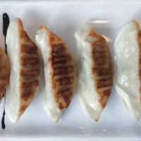 Gyoza · Pork and vegetable fried stickers.