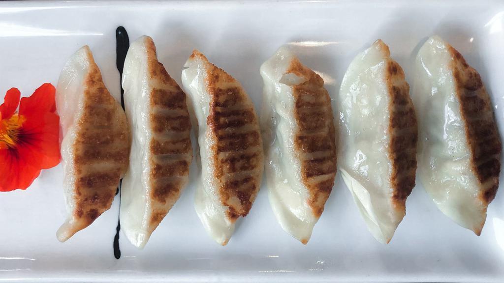 Gyoza · Pork and vegetable fried stickers.