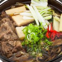Beef Sukiyaki · Sliced new York beef and vegetables in hot pot.