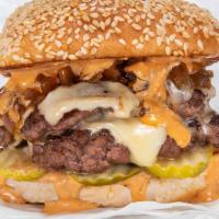 Double Smash Burger · Two black Angus beef patties, white American cheese, pickles, diced onions, caramelized onio...