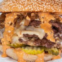 Triple Smash Burger · Three black Angus beef patties, white American cheese, pickles, diced onions, caramelized on...