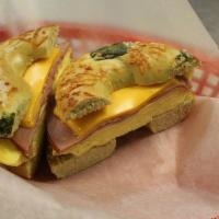 Eggwich Deluxe · Bagel served with Your Choice of Cheese and Meat