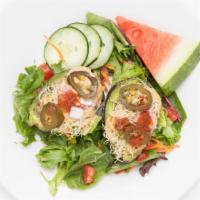 Stuffed Avocado · Raw-Vegan. Sunflower seed pate, cashew cheese, tomatoes, onions sprouts, and spicy tomato dr...