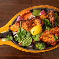 Tandoori Chicken · Chicken Breast and Thigh with bone marinated overnight with spiced yogurt and baked in Tando...