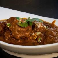 Bombay Saffron Lamb Bhuna · Slow simmered in aromatic juices and flavored with saffron & cumin.