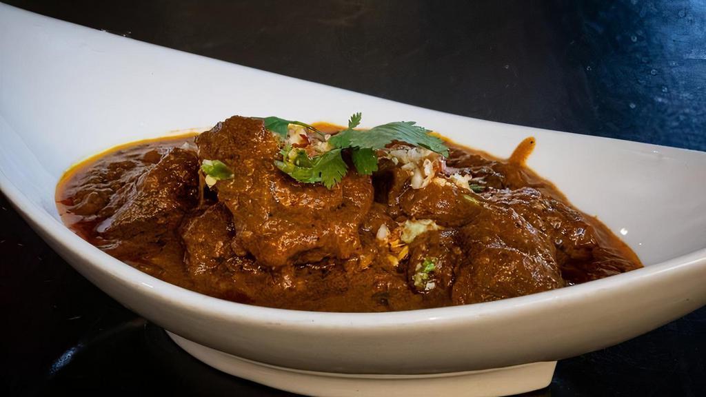Bombay Saffron Lamb Bhuna · Slow simmered in aromatic juices and flavored with saffron & cumin.