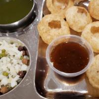 Pani Puri · Vegan. Small crispy puries filled with potatoes, channa, moong, sweet chutney & spiced water.