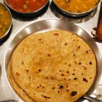 Gujarati Thali · Combo: rice, dal, 2 vegetable curries, 1 kathod (lentil), 2 appetizers, dessert, your choice...
