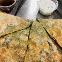 Bombay Quesadilla · Grilled flour tortilla filled with cheese, potatoes, onions, tomatoes, cilantro, spices, chu...