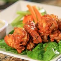 Chicken Wings · Hot wings. Served with ranch or blue cheese dipping sauce.