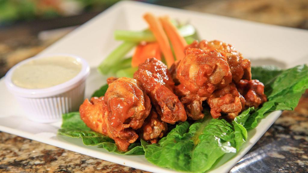Chicken Wings · Hot wings. Served with ranch or blue cheese dipping sauce.