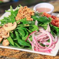 Fresh Baby Spinach Salad · Bacon, mushrooms, candied walnuts, red onions, hard boiled egg, and baby spinach tossed with...
