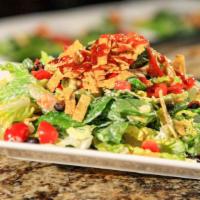BBQ Chicken Salad · Hand-tossed hearts of romaine with ranch dressing, tortilla chips, diced tomatoes, corn, cho...