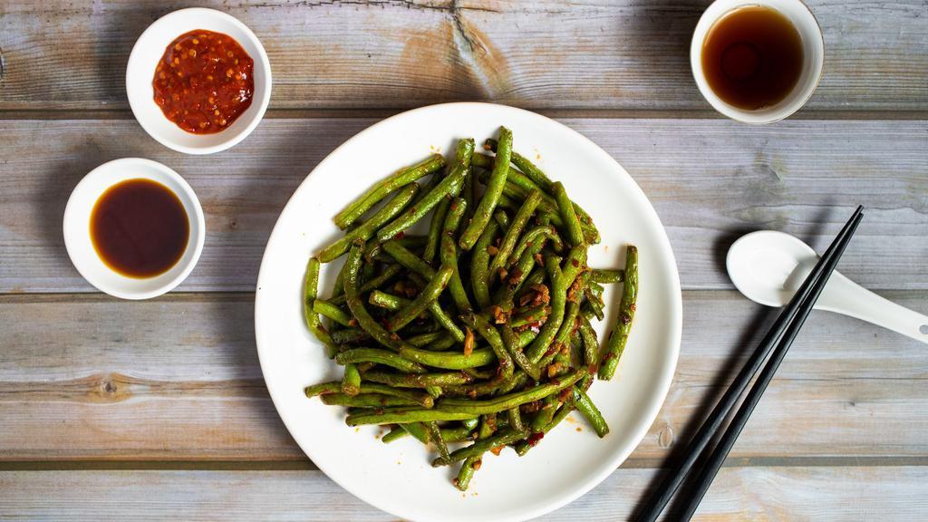 Spicy String Beans · Braised string beans cooked in a spicy Chinese sauce.