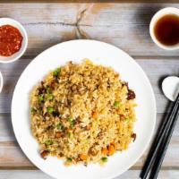 House Fried Rice · Vegan ham with carrot peas cooked and stir fried with rice. Substitute brown rice for an add...