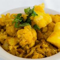 Aloo Ghobi · Cauliflower and potatoes cooked with spices and herbs.