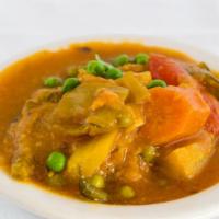 Vegetable Korma · Mixed vegetables cooked with onions, tomatoes and aromatic spices in creamy curry.