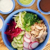 Rotisserie Rice Bowl · Fat rice with pickled onions, radish, cucumber, cabbage & herbs with choice of meat and sauce.