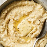 Grits · A bowl of creamy grits.