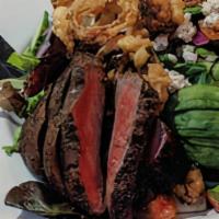 Flat-Iron Steak BLTA · flat iron steak, greens, bacon, tomato, avocado, crumbled blue cheese, onion strings, bacon,...