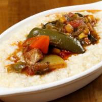 Okra Gumbo over Grits · Gluten-free. Okra, tomato, corn, onions, garlic, bell peppers, and seaweed. The gumbo will s...