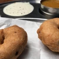 Medhu Vada (2 nos) · Crispy lentil doughnut served with chutney and sambar.