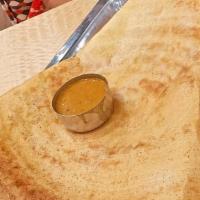 Onion Dosa · Thin crispy rice and lentil crepe topped with onions.