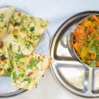 Vegetable Uthappam · Thick rice and lentil pancake topped with vegetables.