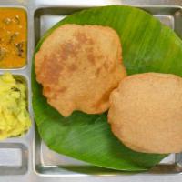 Poori (2 nos) · Fried fluffy whole wheat bread served with mashed potato and curry.