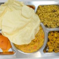 Mini Meal · Bisibelabath, bagalabath, special rice of the day, poriyal, papad, and sweet.