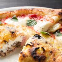 Mezzaluna · Stuffed pizza with prosciutto, mushrooms, fresh ricotta cheese, Grana Padano