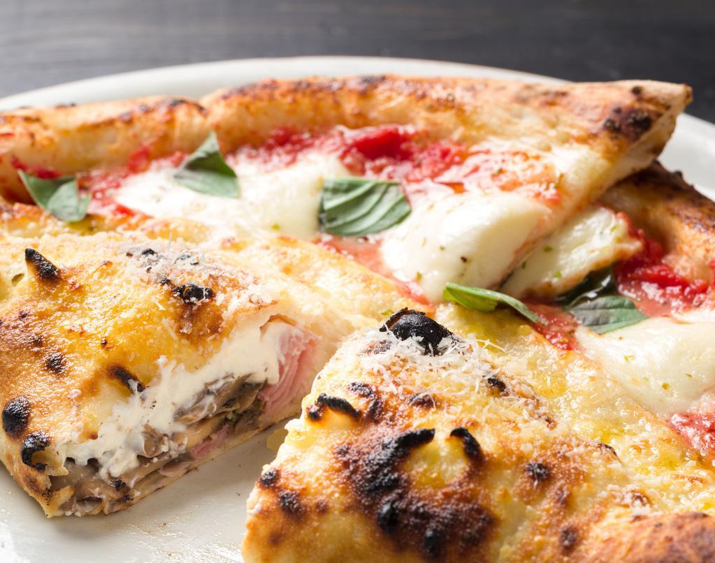 Mezzaluna · Stuffed pizza with prosciutto, mushrooms, fresh ricotta cheese, Grana Padano