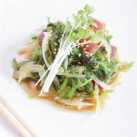 Poki Salad · Tuna, sweet onion, and seaweed salad.
