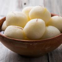 White Rasgulla · Paneer discs cooked and soaked in a simple syrup.