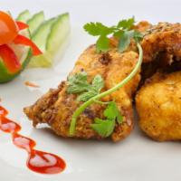 Fish Pakoras · Deep-fried fish fritters spiced to perfection.