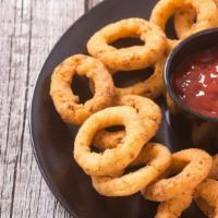 Onion Rings · Lightly battered, sweet onions fried to crispy, golden perfection.
