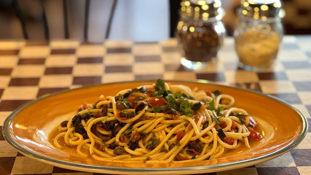 Spaghetti Puttanesca · Fresh Tomatoes, Anchovies, Garlic, Black Olives, Parsley and Caper.