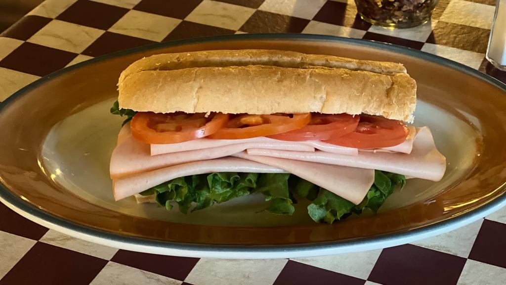 Turkey Breast · Toasted or Cold. Served on French Roll With Tomatoes and Lettuce. Add cheese for an additional charge.