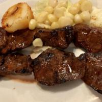 Anticuchos - Shish Kebab · Beef heart marinated in Peruvian sauce and spice.